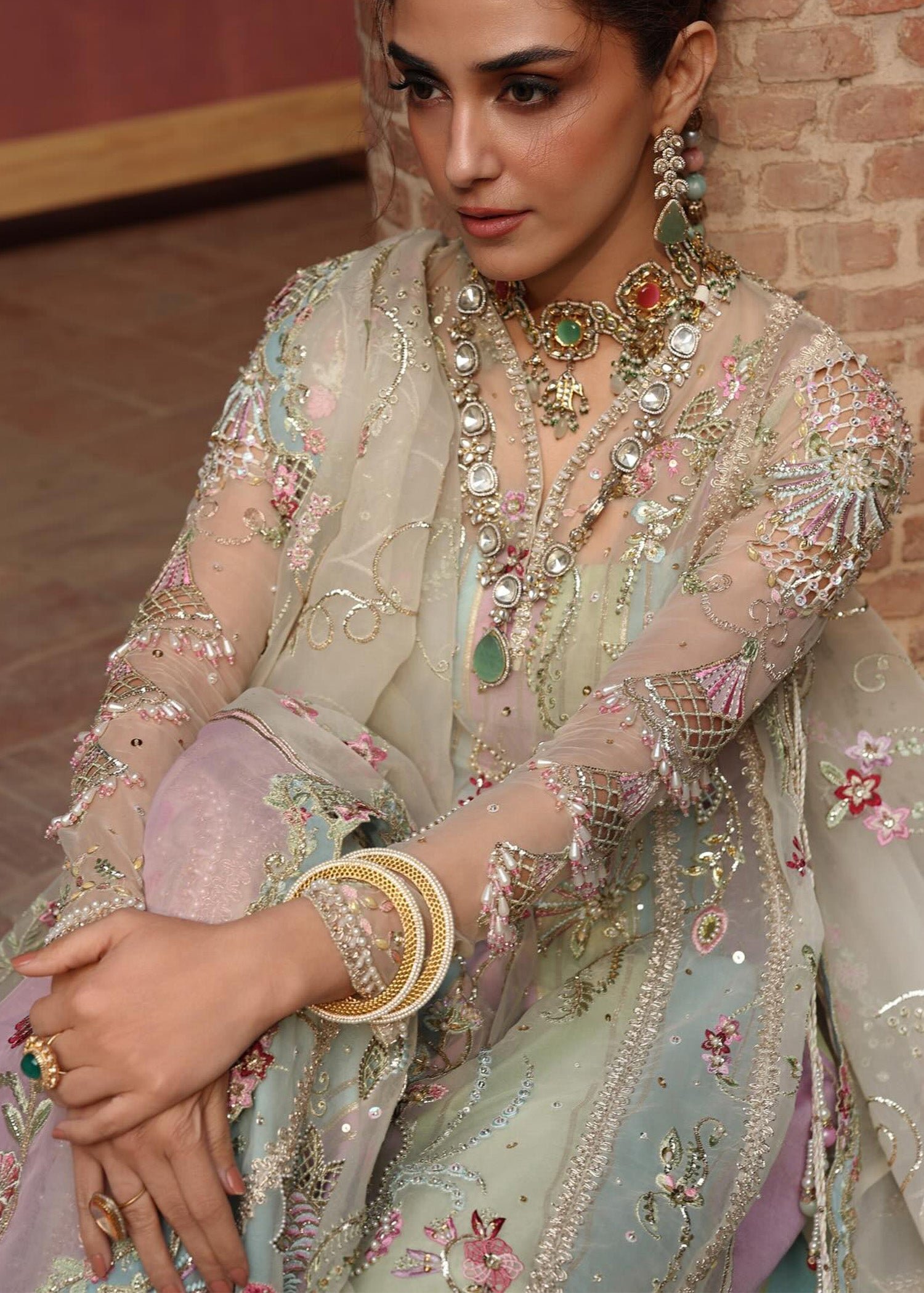 Crimson Rangoli Hand Embellished Raw Silk Bridal Lehenga – Embroidery & Handwork Detail Crimson Rangoli Hand Embellished Raw Silk Bridal Lehenga - Close-Up Hand Embellishment Tilla & Pearl Work | IQNAZ