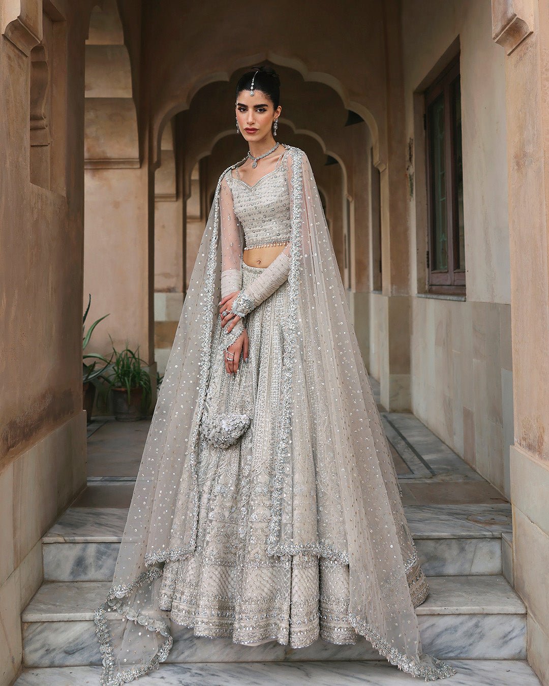 Faiza Saqlain Cammi Hand Embellished Net Bridal Maxi – Model Front View Faiza Saqlain Cammi Hand Embellished Net Bridal Maxi - Model Front Look | Pakistani Designer Replica Wholesale | IQNAZ