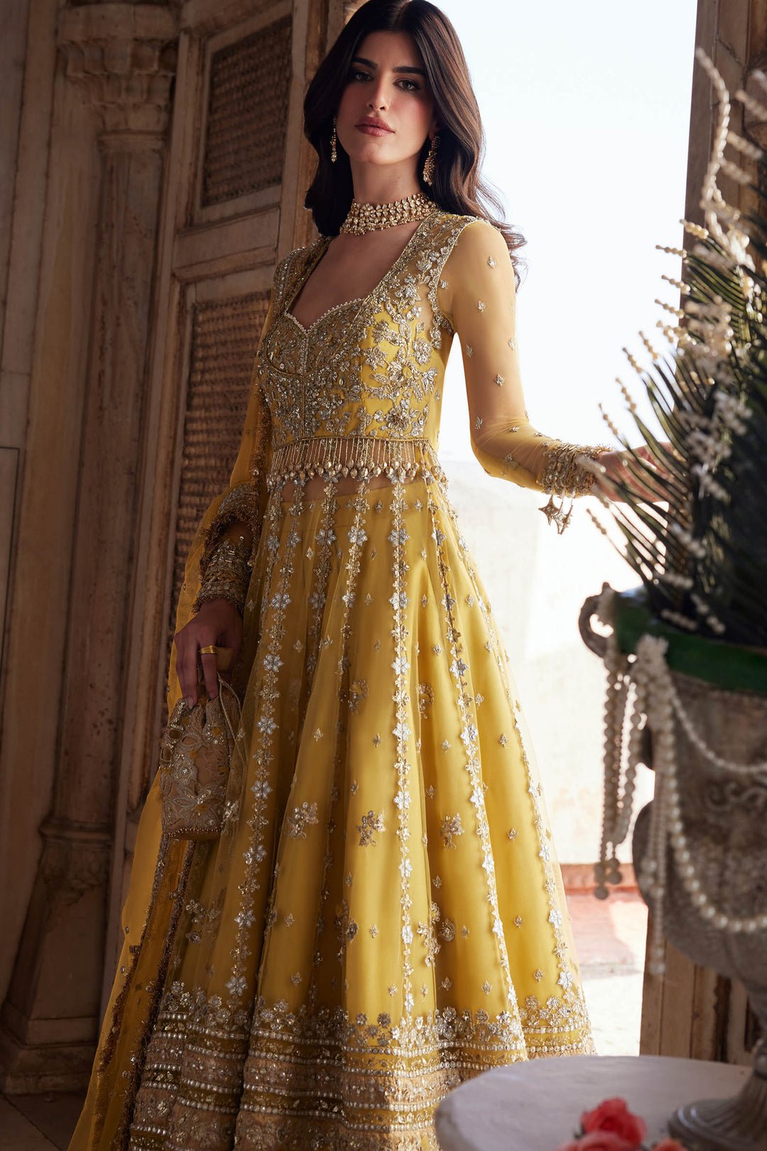 Zaha Surajmukhi Hand Embellished Raw Silk Bridal Lehenga – Embroidery & Handwork Detail Zaha Surajmukhi Hand Embellished Raw Silk Bridal Lehenga - Close-Up Hand Embellishment Tilla & Pearl Work | IQNAZ