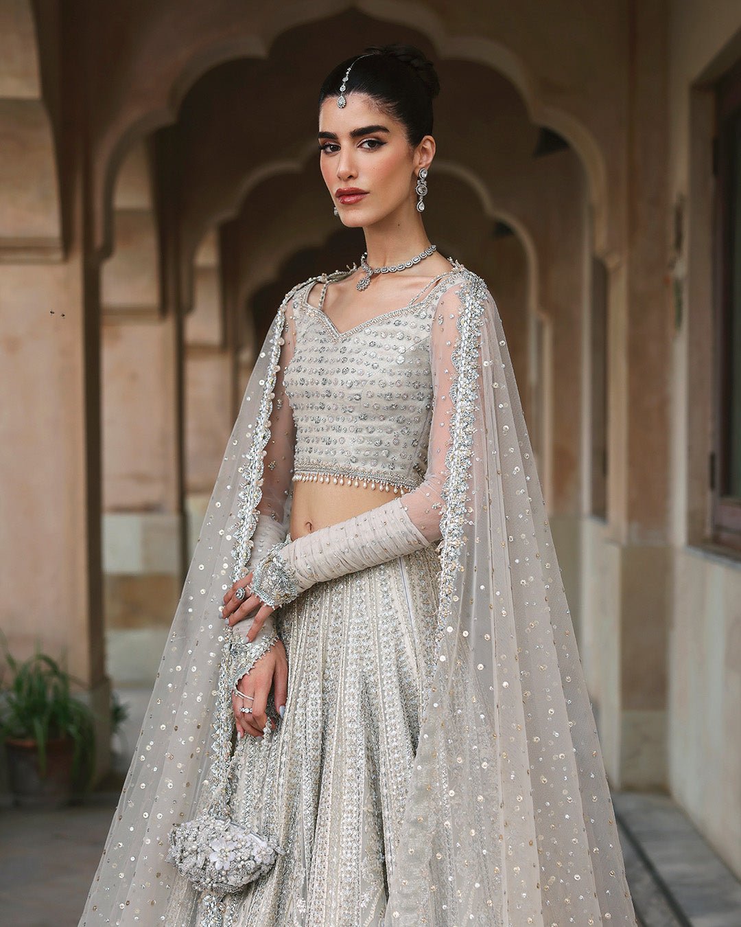 Faiza Saqlain Cammi Hand Embellished Net Bridal Maxi – Embroidery & Handwork Detail Faiza Saqlain Cammi Hand Embellished Net Bridal Maxi - Close-Up Hand Embellishment Tilla & Pearl Work | IQNAZ